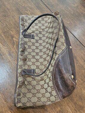 Well loved Gucci Tote. Brown leather with gold Gs.